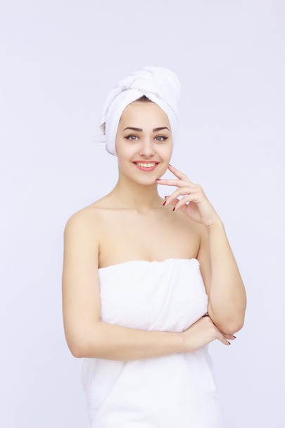 young beautiful woman wrapped in towel - 写真・画像