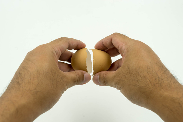 hand on broken egg isolate - Photo, Image