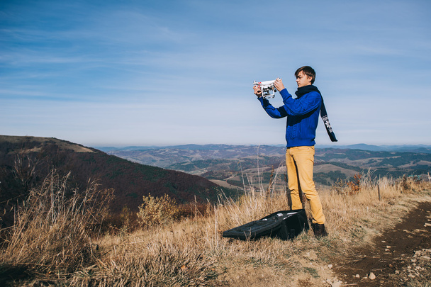 man holding a drone for aerial photography - Fotoğraf, Görsel
