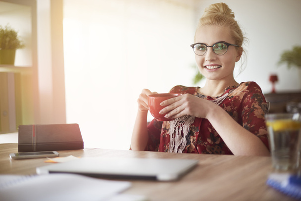 Woman working with cup of coffee  - Photo, Image