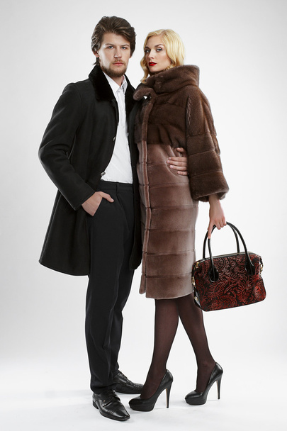 stylish man and glamour woman in fur coat posing - Foto, Imagen