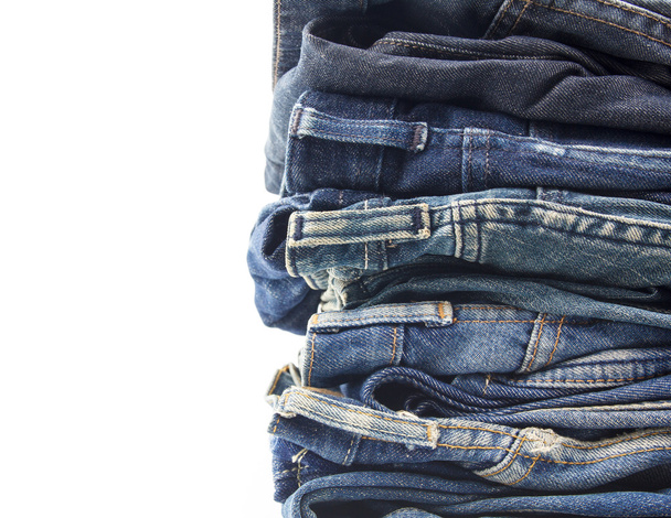 stacked of jeans on white background - Photo, Image
