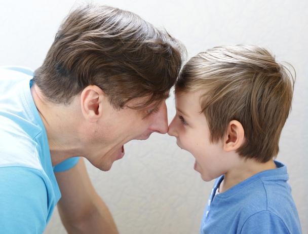 father and son swear, scream and quarrel  - Фото, изображение