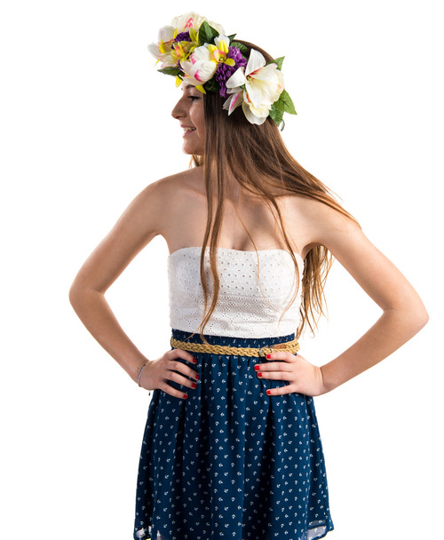 Girl with crown of flowers looking lateral - Фото, изображение