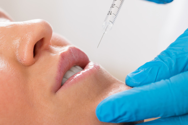 Woman Receive Cosmetic Injection On Lip - Foto, Bild