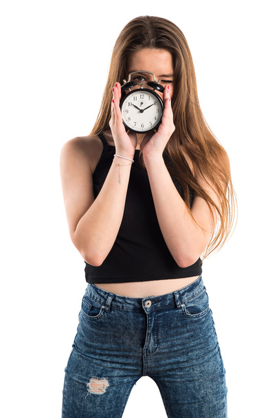 Young girl holding vintage clock - 写真・画像