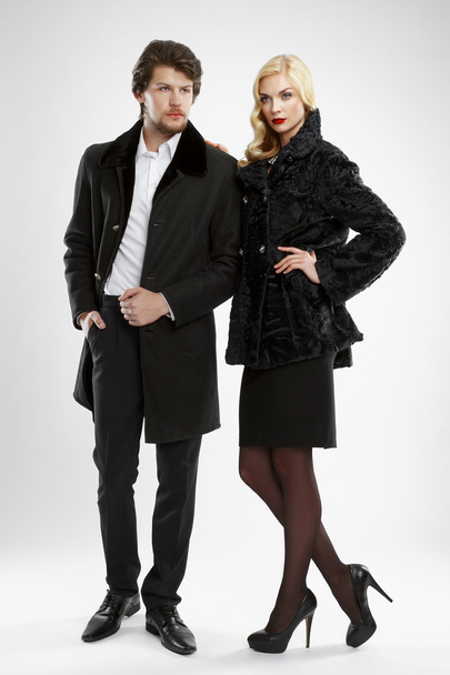 stylish man and glamour woman in fur coat posing - Valokuva, kuva