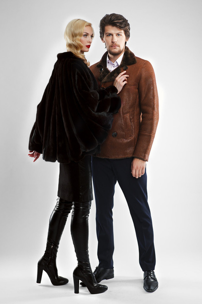 stylish man and glamour woman in fur coat posing - Foto, afbeelding