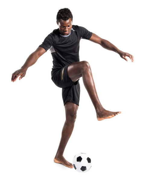 Black man playing football - Foto, afbeelding