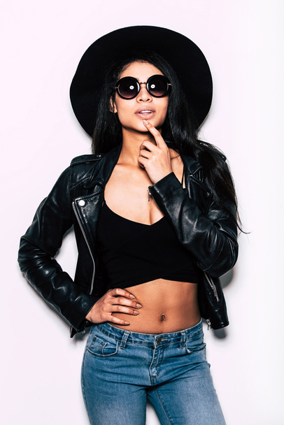 Beautiful woman in leather jacket and hat  - Fotó, kép