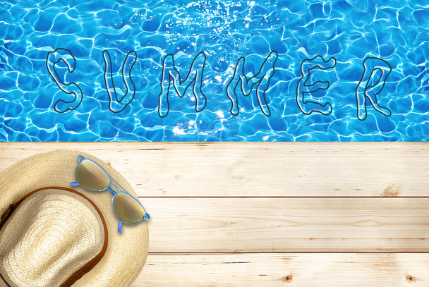 Summer holidays, hat and sunglasses on old wooden floor - Фото, зображення
