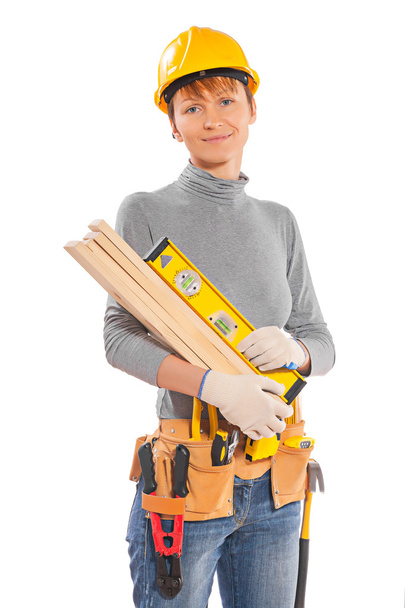 female worker holding planks   - Foto, Imagen