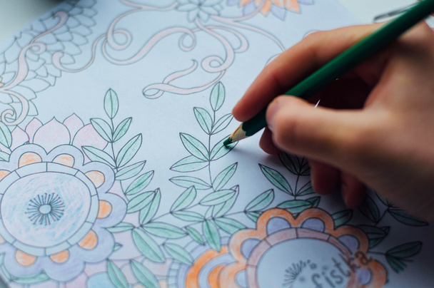 Image of woman coloring, adult coloring book trend, for stress r - Фото, зображення