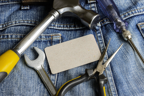 Several tools on a denim workers pocket - Photo, Image