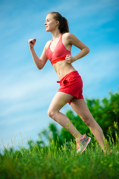 Young woman running summer park rural road. Outdoor exercises. J - Zdjęcie, obraz