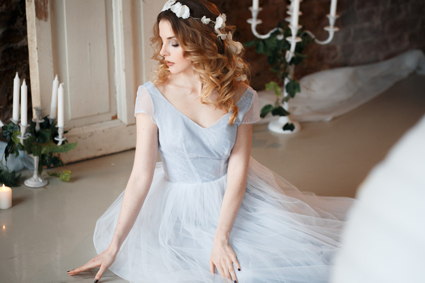 Bride in a tender light blue wedding dress in a morning over fantastic creative decoration. Fashion beauty portrait - Φωτογραφία, εικόνα