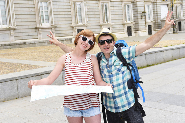young tourist friends couple visiting Madrid in Spain together smiling happy and relaxed - 写真・画像