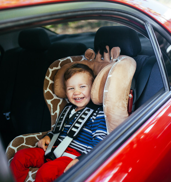 Adorable baby boy in safety car seat.  - 写真・画像