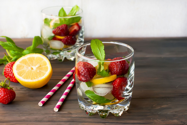 Strawberry mojito cocktail with mint and ice selective focus - 写真・画像