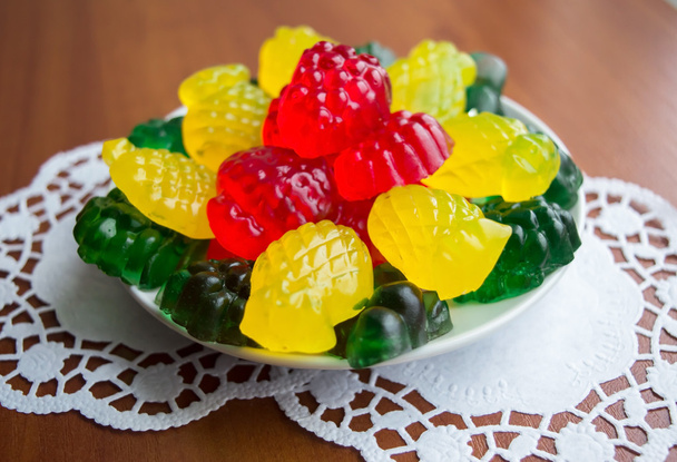Colourful fruit jelly candies on a white plate - Photo, Image