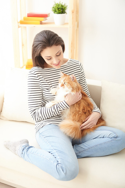 Pretty girl is playing with her pet - 写真・画像