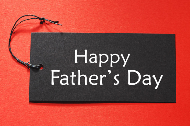 Happy Fathers Day text on a black tag - Φωτογραφία, εικόνα