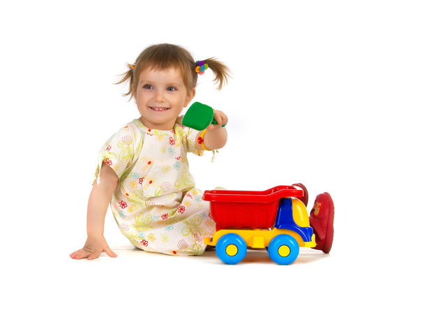 Pretty little girl and her toys - Foto, Imagen