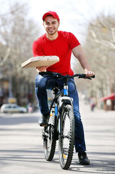 man with bike delivering pizza - Fotoğraf, Görsel