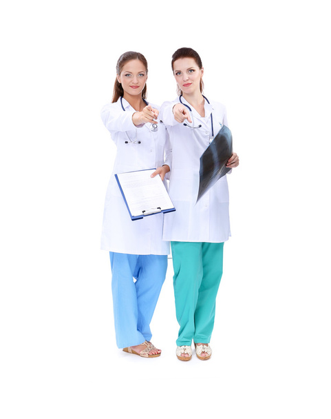 Two woman nurse watching X Ray image, standing in hospital - Zdjęcie, obraz