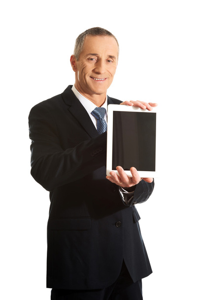 Happy businessman holding digital tablet - Fotografie, Obrázek