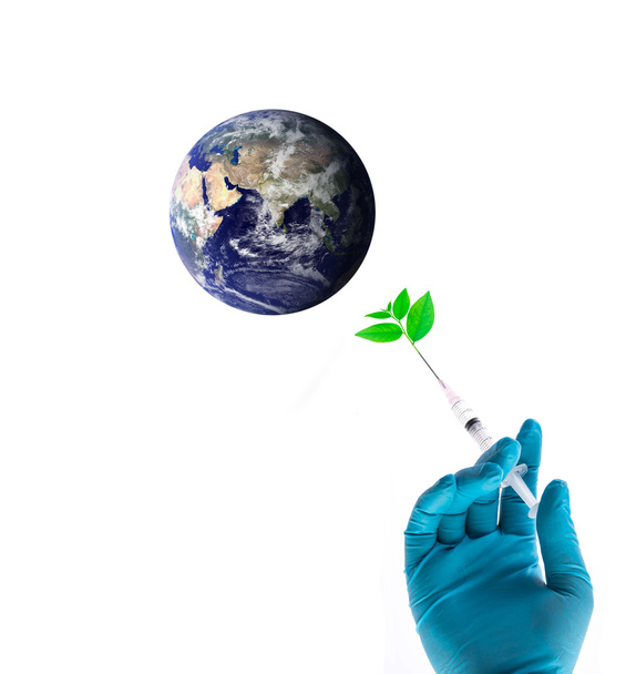 Egy kék kesztyű gazdaság fecskendő ugyanakkor beadni növény a világon, biztonságos világ fogalma, elemei ennek a képnek a Nasa berendezett - Fotó, kép