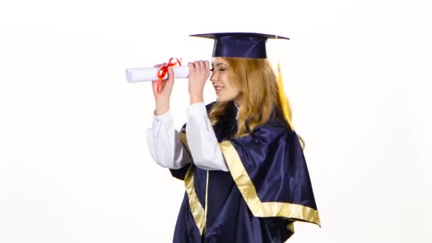 Woman with graduation gown and diplom. White - Πλάνα, βίντεο