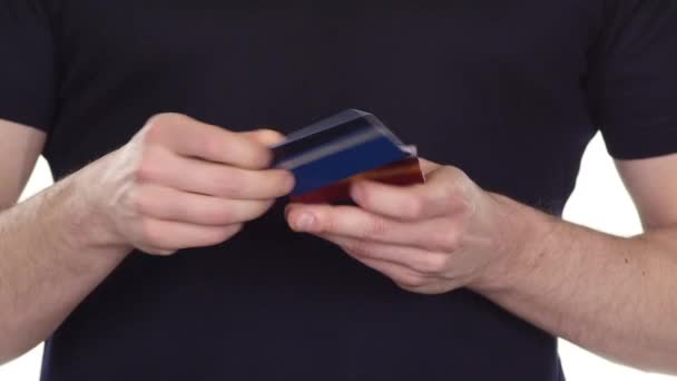 Credit card in hands. Planned online shopping. White. Close up - Filmagem, Vídeo