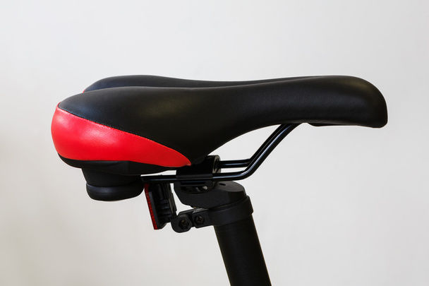 closeup of a bicycle saddle at the white background - Foto, afbeelding