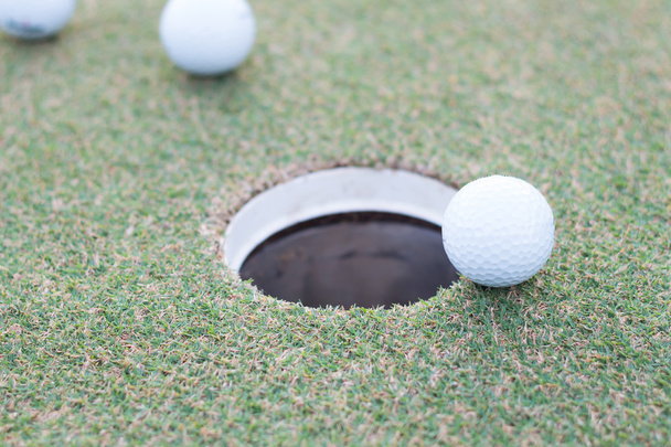 golf ball near hold on green tee - Photo, Image