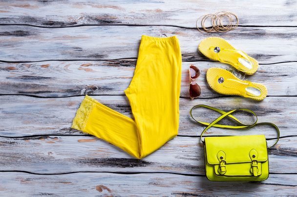 Yellow pants with lime purse. - Φωτογραφία, εικόνα