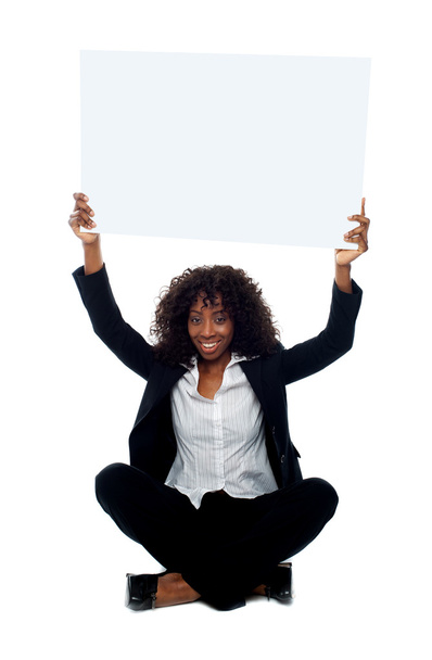 Female executive with whiteboard over her head - Фото, зображення