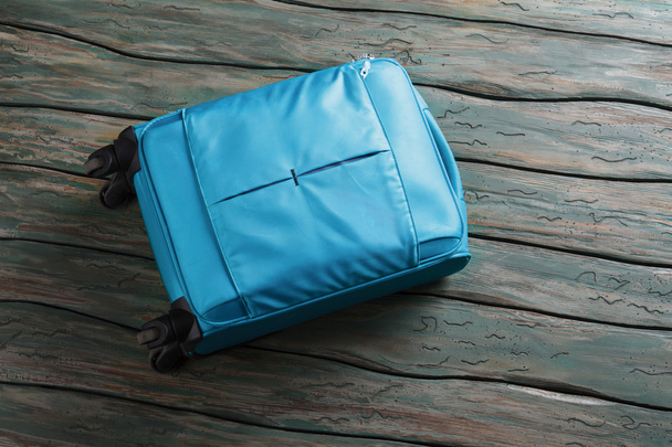 Blue luggage bag on wheels. - Photo, Image