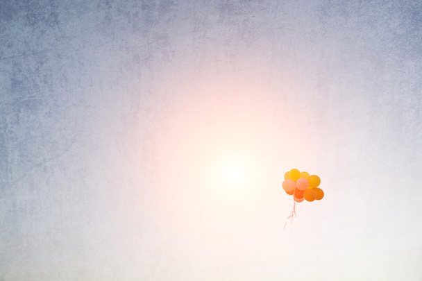 vintage of colorful balloons flying away into the sky - Photo, Image