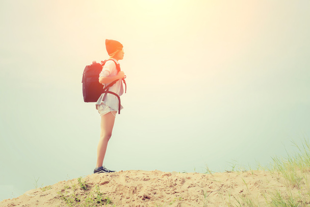 Teenage girl wearing glasses, carrying a backpack to the travel. - Photo, Image