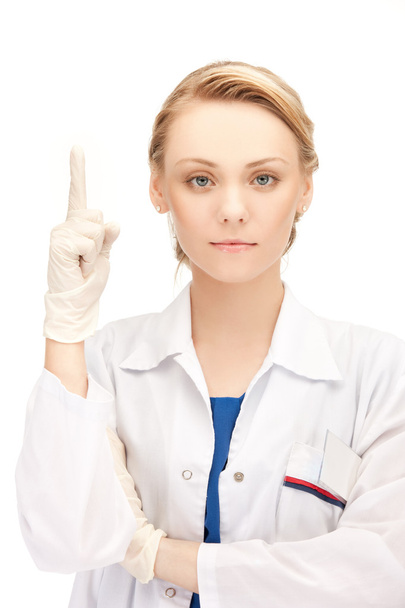 Female doctor with her finger up - Foto, Imagen