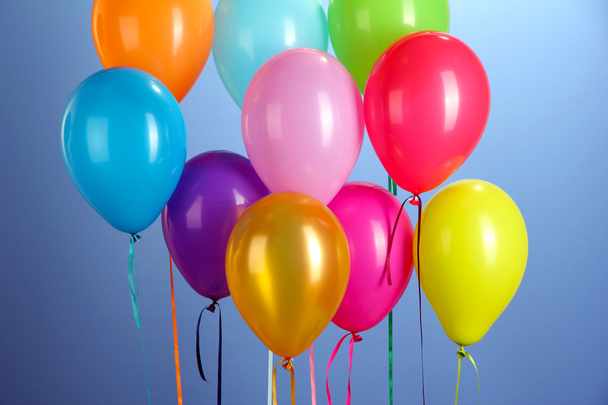 Colorful balloons on blue background close-up - Photo, Image