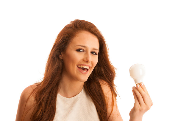 Woman with lightbulb as a sign for fresh idea  - Photo, Image