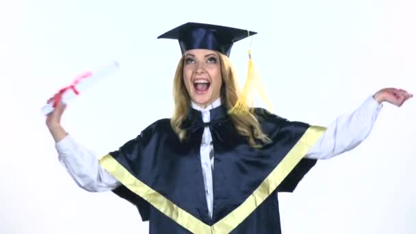 Graduate dancing with diploma in hand. White. Slow motion - Video, Çekim