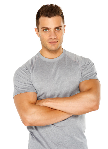 Happy fit male posing over white background - Foto, Imagem