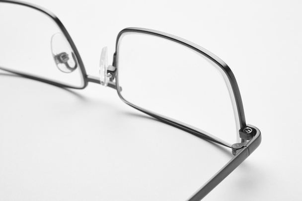 Male eyeglasses macro detail over a white background - Photo, Image