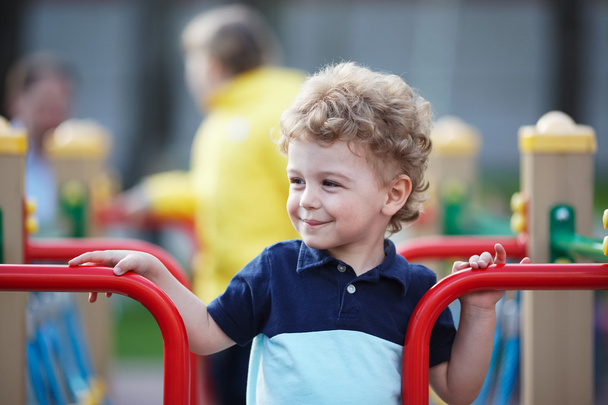 Small boy is playing on the playground - Photo, Image