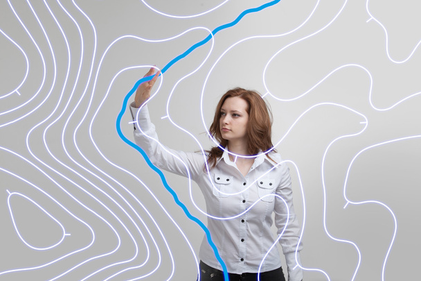 Geographic information systems concept, woman scientist working with futuristic GIS interface on a transparent screen. - Foto, afbeelding