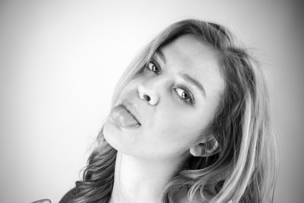 Woman sticking tongue out - Photo, Image