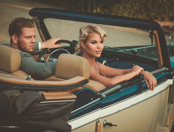 couple in a classic convertible  - Фото, зображення